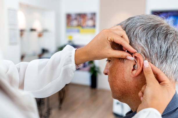 Hearing specialist speaking with a patient